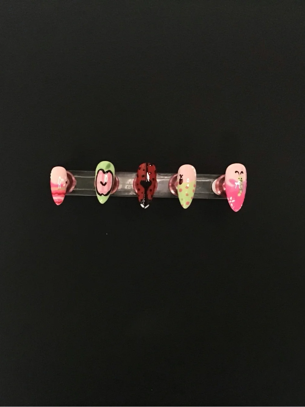 Pink, green, and red press on nail set.